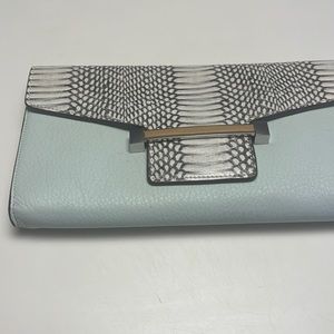 Never used aqua color with snake closure